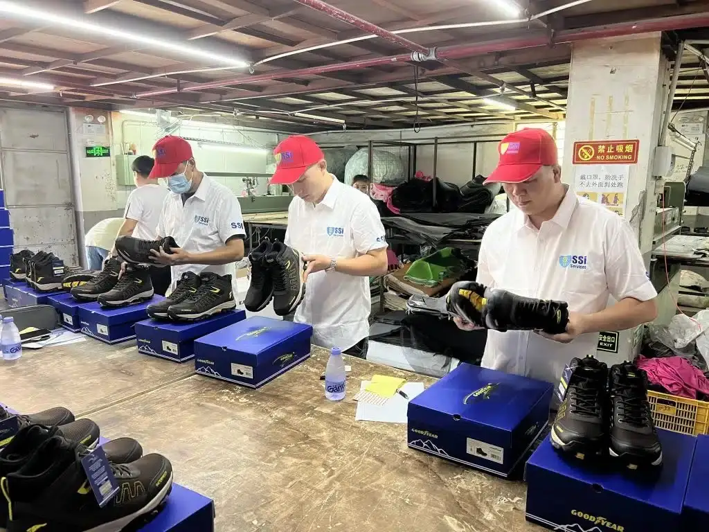 Inspecting a batch of shoes before shipment